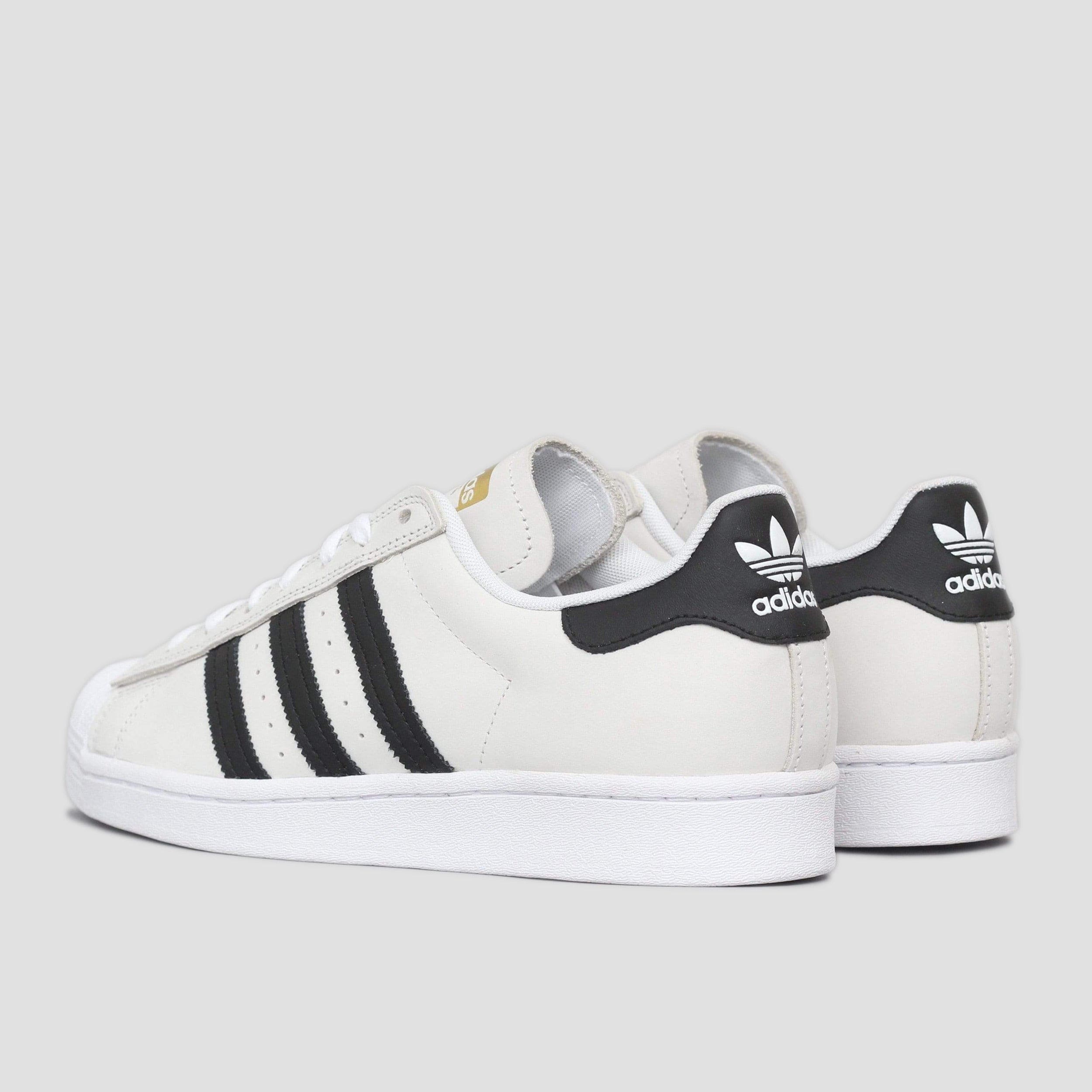 Superstar black on sale and gold stripes